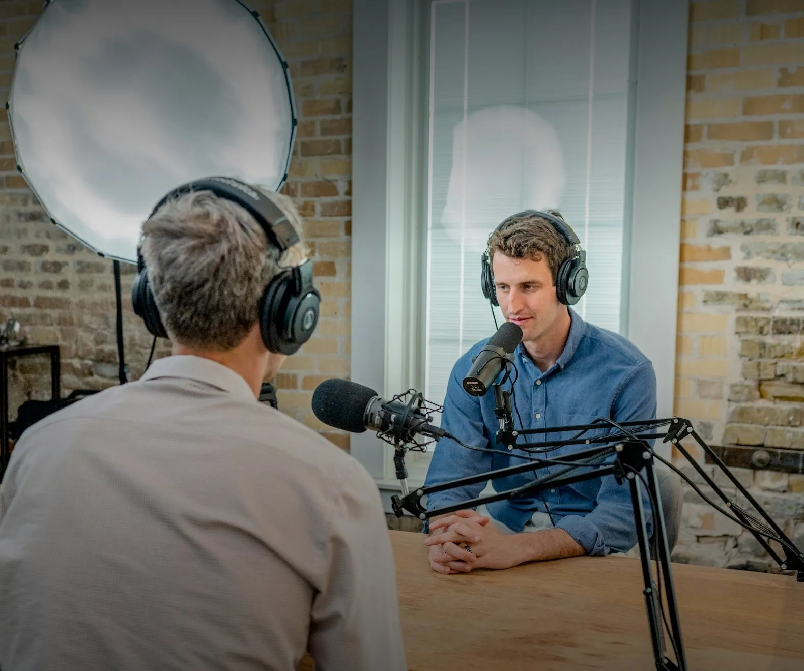 Two founders recording a podcast in their studio